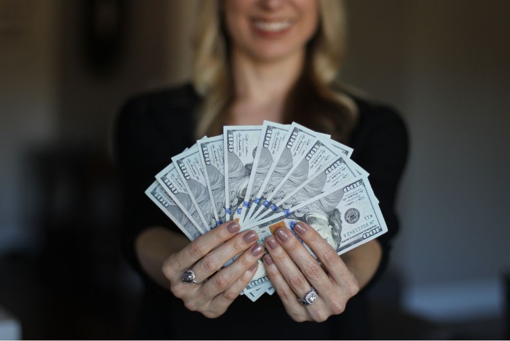 Woman showing money